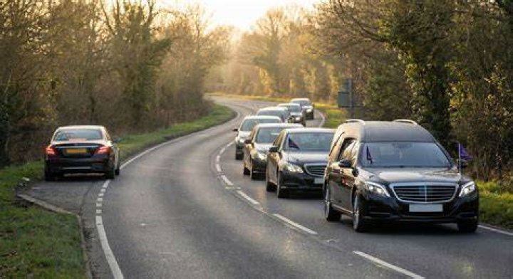 What do you do when you pass a funeral procession?